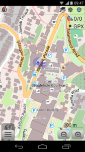 A screenshot of the OSMand app, showing the outlines of buildings, parks, and roads